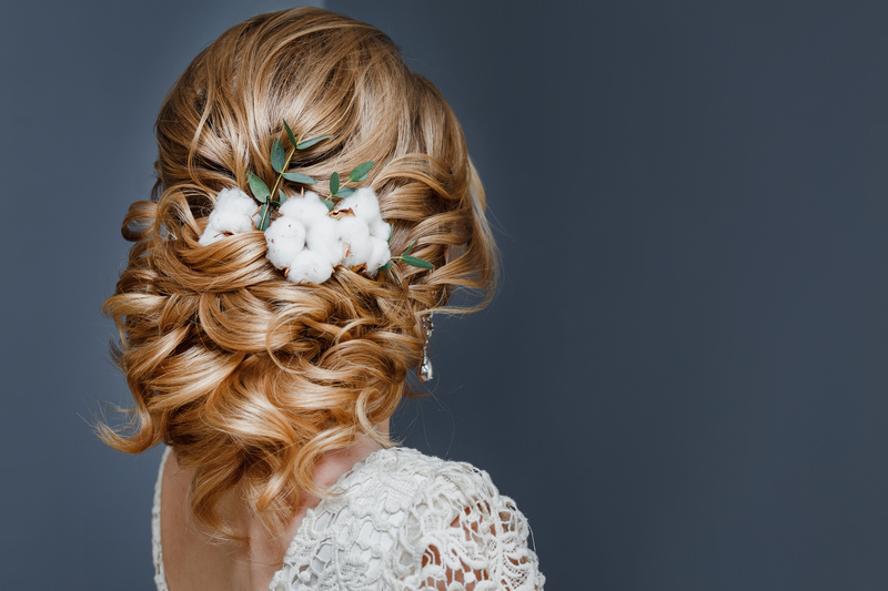 beauty wedding hairstyle decorated with cotton flower.