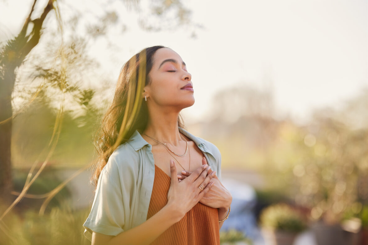 a women in outdoors breathing fresh air